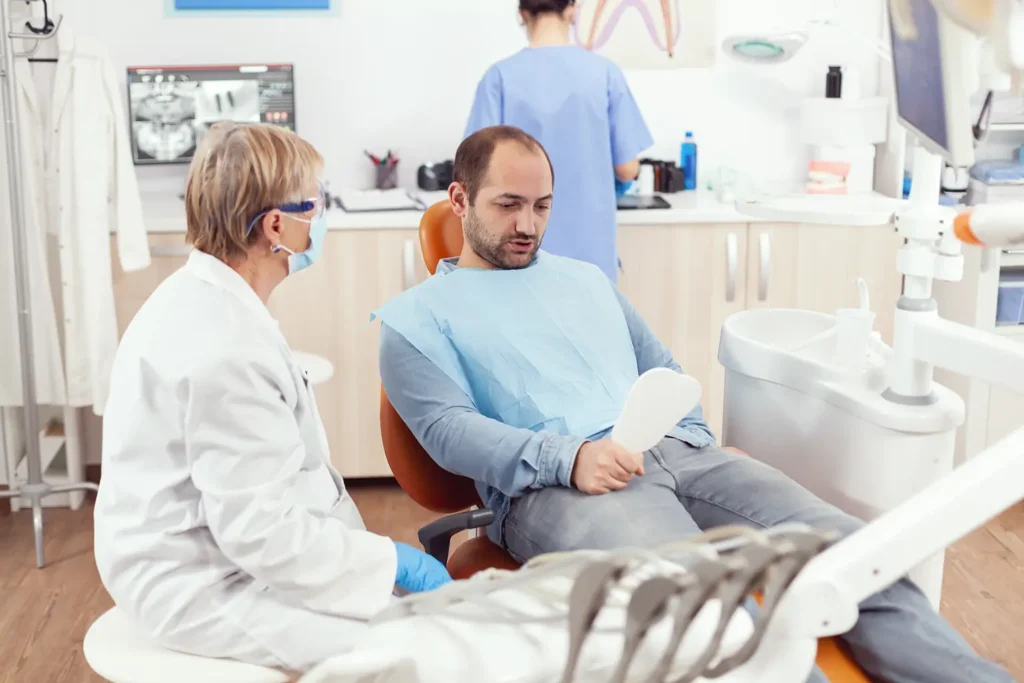 Patient receiving emergency dental care consultation from a dentist at Big Sky Family Dental in Billings, MT, highlighting the importance of immediate professional attention.